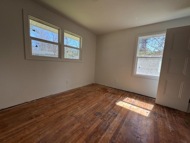 unfurnished room featuring wood-type flooring