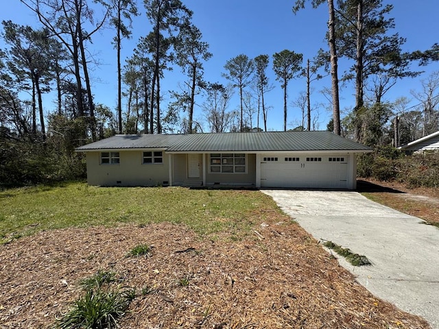 ranch-style house with an attached garage, a front lawn, metal roof, crawl space, and driveway