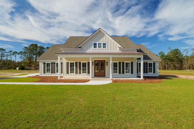 3376 Bemiss Knights Academy Rd, Valdosta, GA 31605 - view of front of house with board and batten siding, a porch, and a front yard
