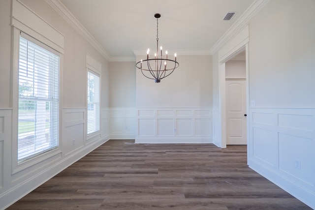 3376 Bemiss Knights Academy Rd, Valdosta, GA 31605 - unfurnished dining area with a chandelier, a decorative wall, crown molding, dark wood finished floors, and a wainscoted wall