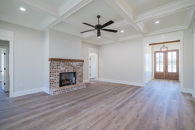 3376 Bemiss Knights Academy Rd, Valdosta, GA 31605 - unfurnished living room with coffered ceiling, ornamental molding, beamed ceiling, wood finished floors, and french doors