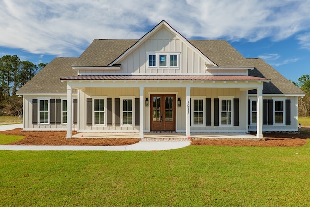 3376 Bemiss Knights Academy Rd, Valdosta, GA 31605 - back of property with board and batten siding, covered porch, a lawn, and roof with shingles