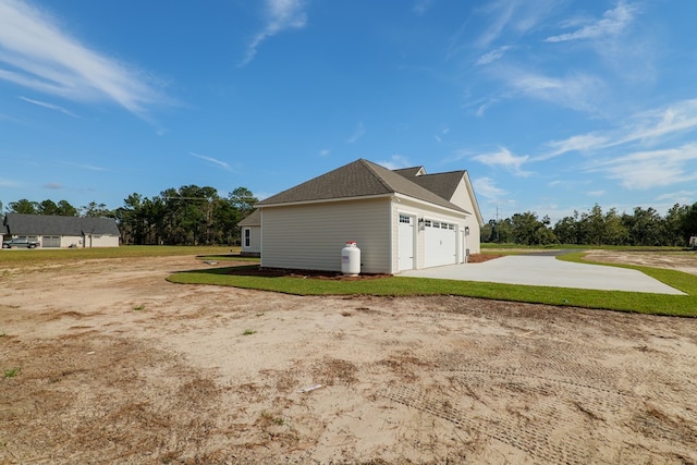 3376 Bemiss Knights Academy Rd, Valdosta, GA 31605 - view of home's exterior featuring concrete driveway, a garage, and a yard
