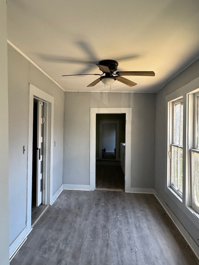 218 Teddy St, Thomasville, GA 31792 - unfurnished room with a wealth of natural light, dark wood-type flooring, and baseboards