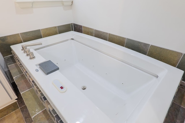 bathroom featuring a relaxing tiled tub