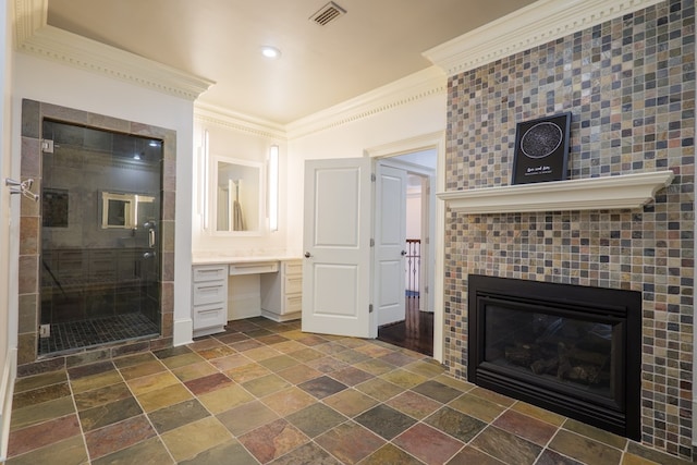 unfurnished living room featuring crown molding, built in desk, and a fireplace