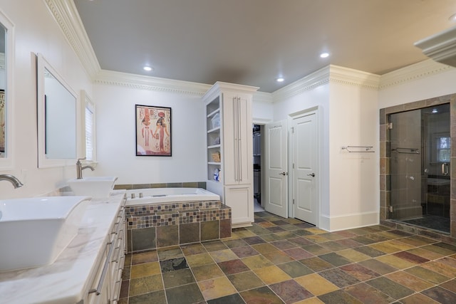 bathroom featuring ornamental molding, vanity, and plus walk in shower