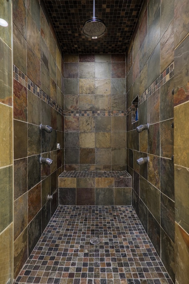 bathroom featuring tiled shower