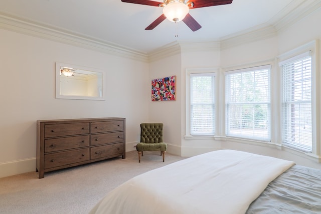 bedroom featuring crown molding, light colored carpet, and ceiling fan