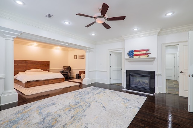 bedroom with dark hardwood / wood-style flooring, ornamental molding, decorative columns, and ceiling fan