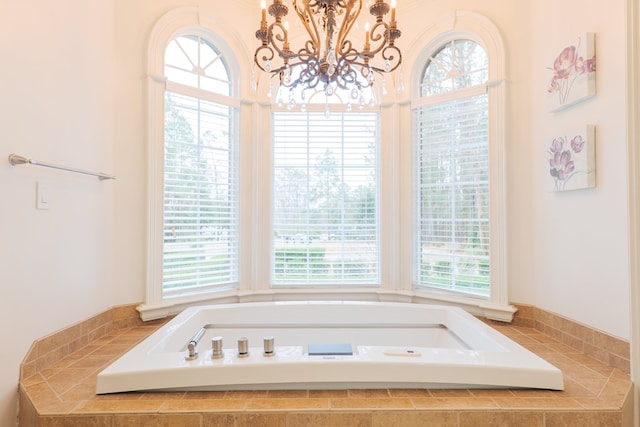 bathroom with plenty of natural light and a relaxing tiled tub