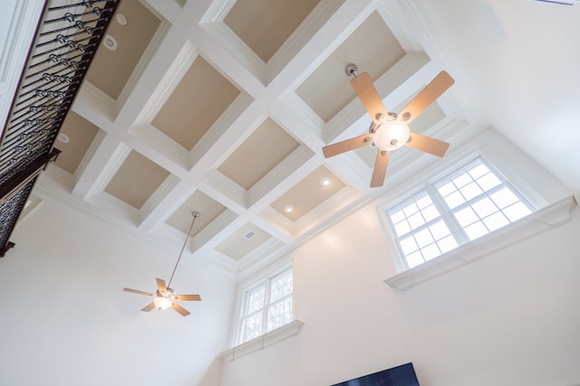 room details featuring ceiling fan, ornamental molding, coffered ceiling, and beam ceiling