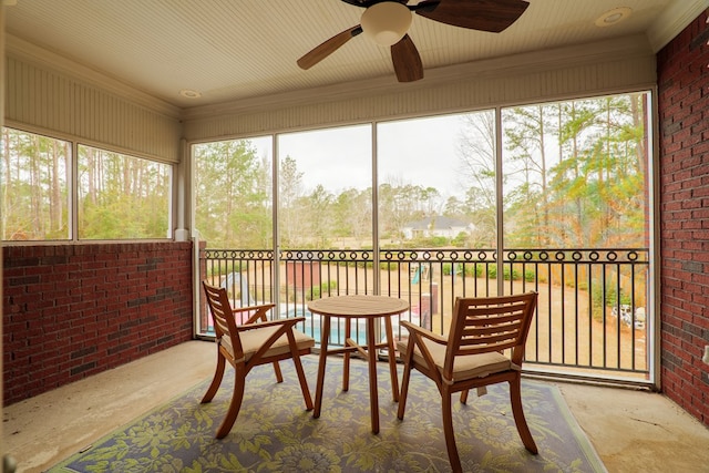 sunroom featuring ceiling fan