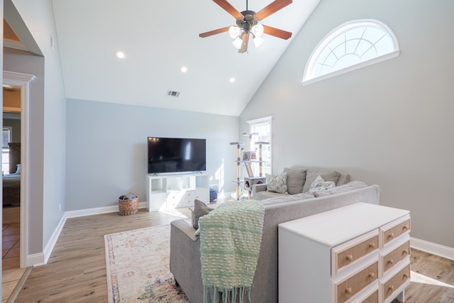 bedroom featuring baseboards, visible vents, light wood finished floors, high vaulted ceiling, and recessed lighting