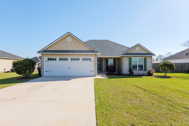 view of front facade with a garage, concrete driveway, and a front yard