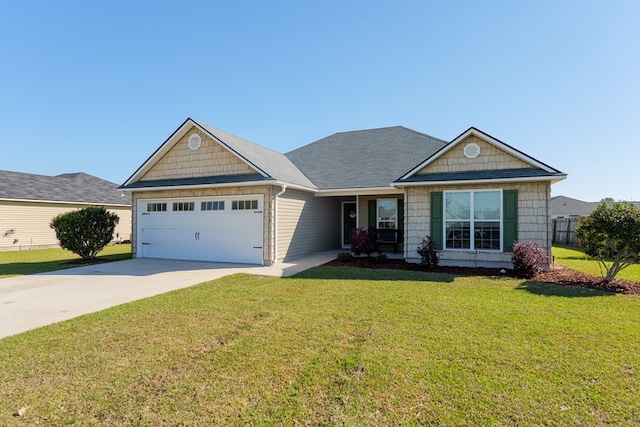 view of front of property featuring a front lawn, a garage, and driveway