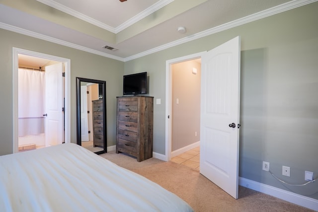 bedroom featuring visible vents, light carpet, a tray ceiling, crown molding, and baseboards