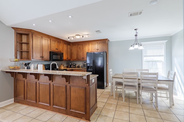 kitchen featuring visible vents, brown cabinets, a peninsula, black appliances, and open shelves