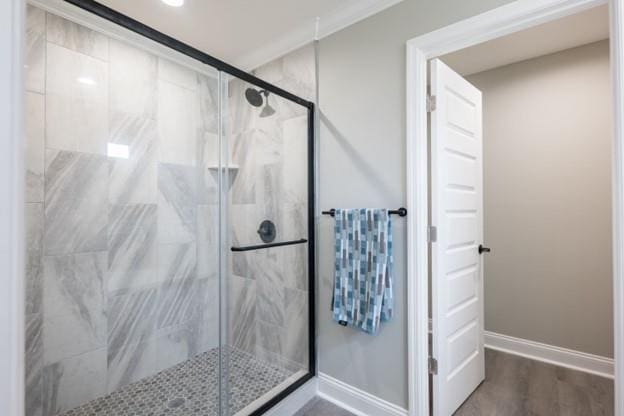 4639 Castle Pines Ln, Lake Park, GA 31636 - full bath featuring a marble finish shower, baseboards, and wood finished floors