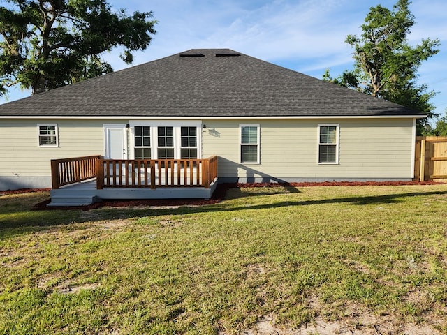 4639 Castle Pines Ln, Lake Park, GA 31636 - rear view of house with a lawn, a shingled roof, fence, and a deck