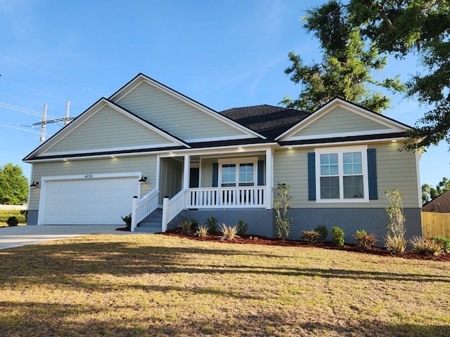 4639 Castle Pines Ln, Lake Park, GA 31636 - view of front facade with a porch, an attached garage, driveway, and a front yard
