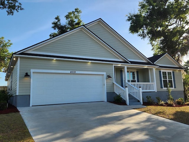 4639 Castle Pines Ln, Lake Park, GA 31636 - view of front of house with an attached garage, concrete driveway, and a porch