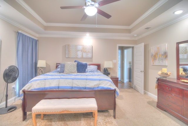 bedroom featuring a raised ceiling, baseboards, visible vents, and light carpet