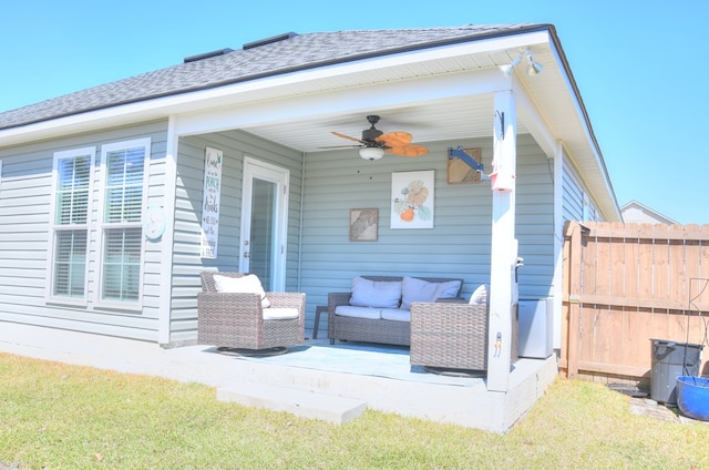 view of patio / terrace with outdoor lounge area, a ceiling fan, and fence