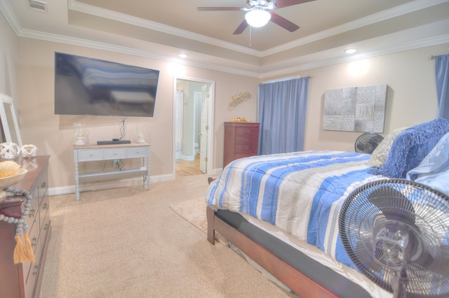 bedroom featuring visible vents, ornamental molding, baseboards, carpet, and a raised ceiling