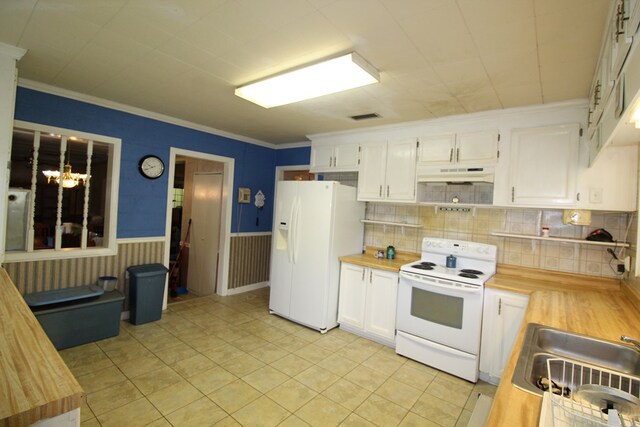 kitchen with sink, wood counters, a notable chandelier, white appliances, and white cabinets