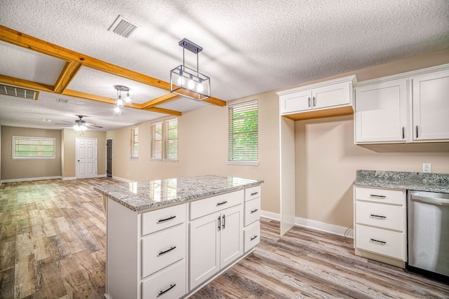 kitchen featuring light wood-style floors, white cabinetry, visible vents, and stainless steel dishwasher