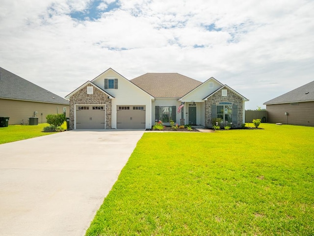 3956 Crusader Ct, Valdosta, GA 31605 - craftsman-style home featuring stone siding, a front lawn, driveway, and a garage