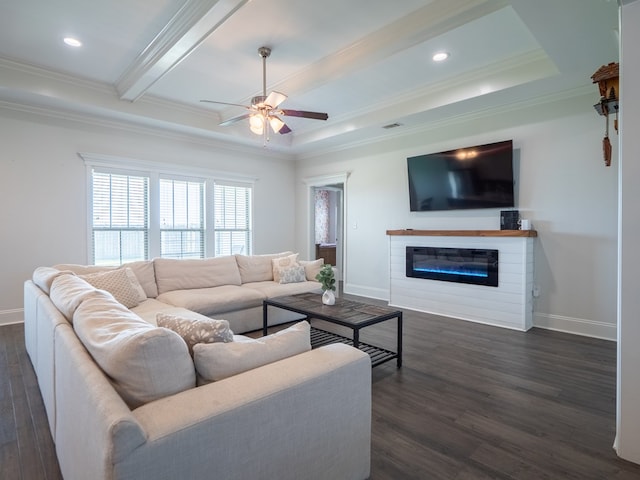 3956 Crusader Ct, Valdosta, GA 31605 - living area with dark wood-style flooring, a ceiling fan, crown molding, a glass covered fireplace, and beam ceiling
