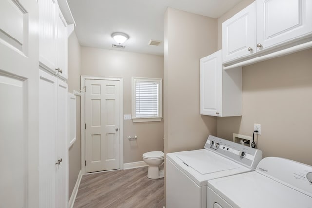 561 Sevilla Spring Cir, Lake Park, GA 31636 - laundry room with washer and clothes dryer, light wood-type flooring, and baseboards