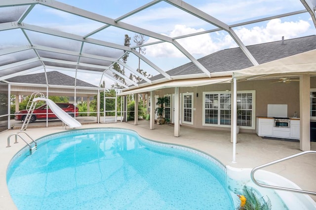 561 Sevilla Spring Cir, Lake Park, GA 31636 - outdoor pool with a water slide, a patio, ceiling fan, and a lanai