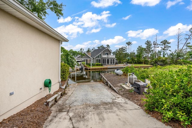 561 Sevilla Spring Cir, Lake Park, GA 31636 - view of patio / terrace featuring a water view