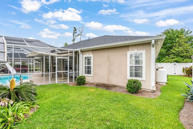 561 Sevilla Spring Cir, Lake Park, GA 31636 - rear view of house with a patio area, stucco siding, a lanai, a gate, and a shingled roof
