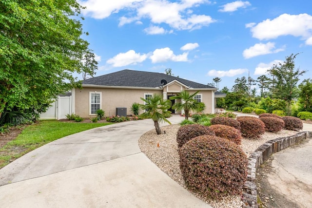 561 Sevilla Spring Cir, Lake Park, GA 31636 - view of front of property featuring stucco siding, central air condition unit, and driveway