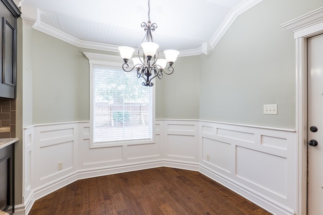 unfurnished dining area with crown molding, wood-type flooring, a healthy amount of sunlight, and a chandelier