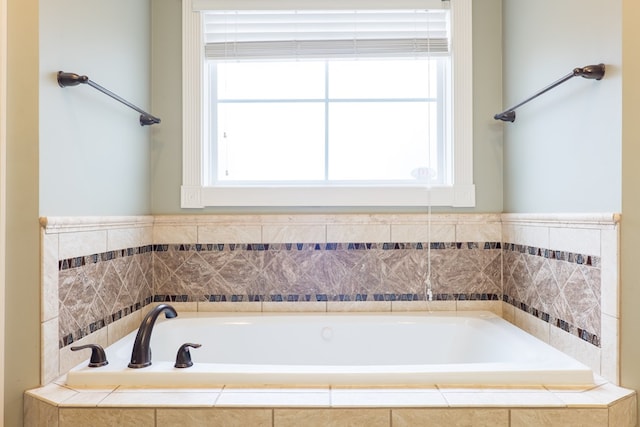 bathroom with a relaxing tiled tub