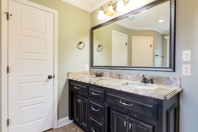 bathroom featuring ornamental molding and vanity