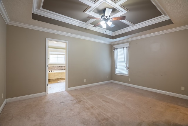 empty room with ceiling fan, ornamental molding, light carpet, and a wealth of natural light