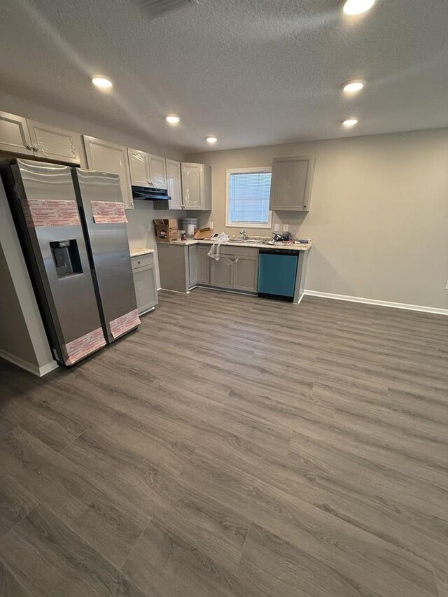 bathroom with a bath and concrete floors