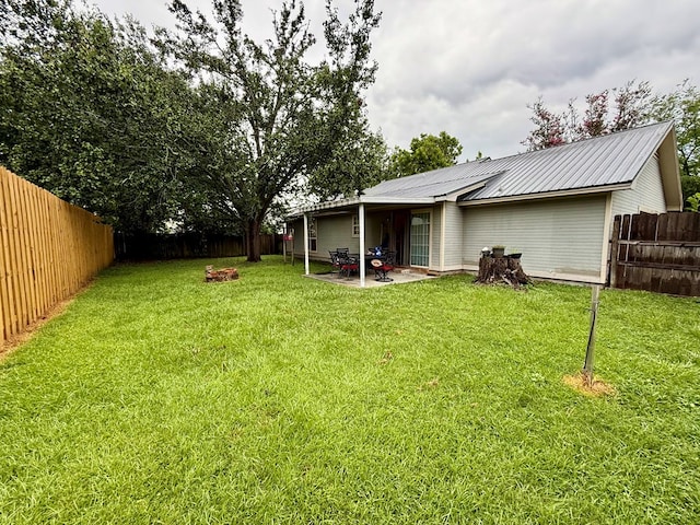 325 Jennifer Cir, Valdosta, GA 31605 - fenced backyard with a patio area