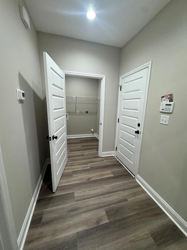 hall with dark hardwood / wood-style flooring