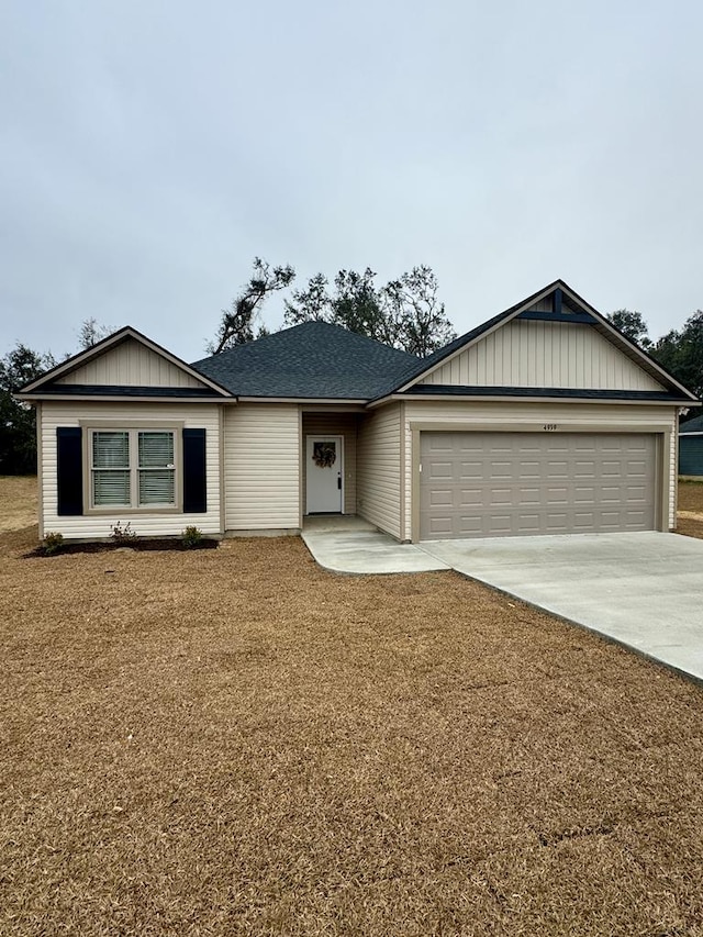 single story home featuring a front yard and a garage