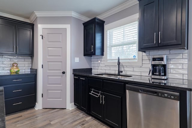 kitchen with sink, backsplash, dishwasher, and light wood-type flooring