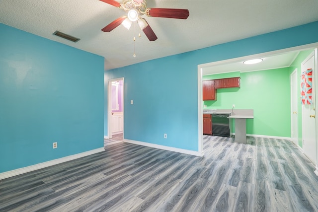 5209 Sequani Cir, Lake Park, GA 31636 - unfurnished living room featuring wood finished floors, a ceiling fan, and a textured ceiling