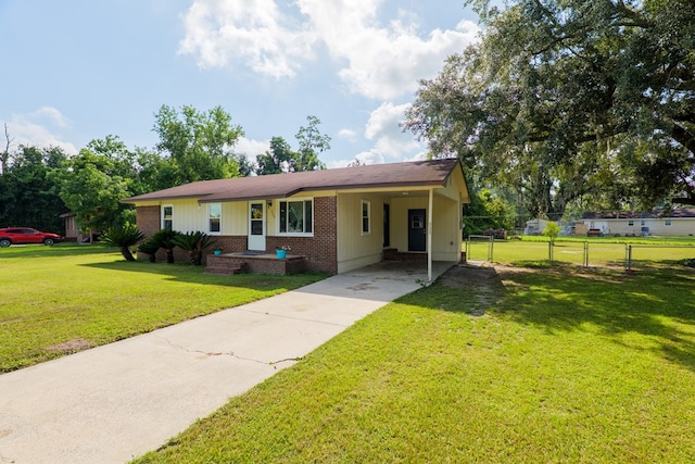 5209 Sequani Cir, Lake Park, GA 31636 - view of front of house with brick siding, concrete driveway, an attached carport, and board and batten siding