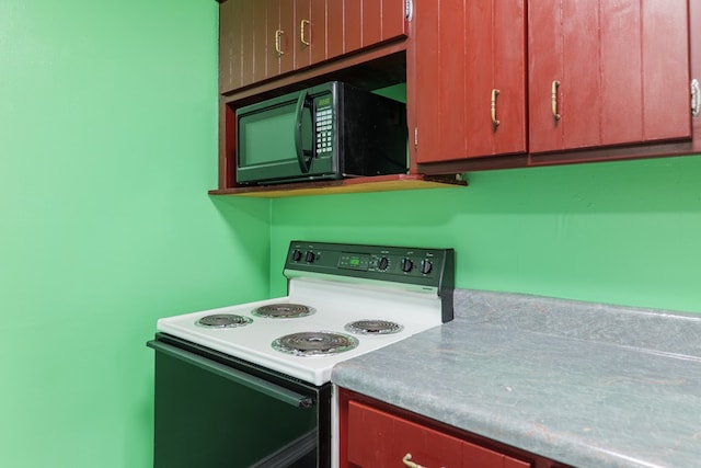 5209 Sequani Cir, Lake Park, GA 31636 - kitchen featuring range with electric stovetop and black microwave